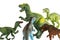Group of smaller toy Tyrannosaurus Rex dinosaurs attacking adult Tyrannosaurus