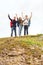 Group of smiling friends with backpacks hiking