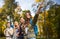 Group of smiling friends with backpacks hiking