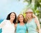 Group of smiling girls chilling on the beach