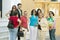 Group of smiling people near front of church in village of Southern Spain off highway A49 west of Sevilla