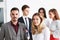 Group of smiling people stand in office