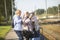 Group of smiling senior women take a self-portrait on a platform waiting for  train to travel during a COVID-19 pandemic