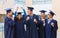 Group of smiling students in mortarboards