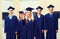 Group of smiling students in mortarboards