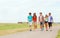 Group of smiling teenagers walking outdoors