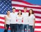 Group of smiling teenagers in white blank t-shirts