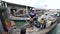 Group sort fresh fishes at traditional fishing village