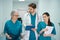 Group of specialist doctors walk along corridor of diagnostic department