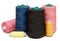 Group of spools of color sewing threads on white background