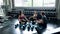 Group of sportive people in a gym training - Multiracial group of athletes sitting on floor relax after stretching