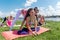 Group of sportive people stretching before starting a workout outdoors