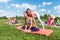 Group of sportive people stretching before starting a workout outdoors