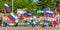 A group of sports children with Russian flags and sports posters in the park on a summer day. Russian text: Russia forward, Victor