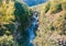 A group of sportsman kayakers in granite canyon of the mountain river