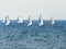 A group of sportsmans on small sailing yachts trains on the Mediterranean Sea near the coast of Nahariyya in Israel