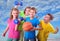 Group of sporty children friends with dumbbells and ball