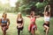 Group of sporty young woman doing workout at public park in the morning,Best friends warming up body at outdoor