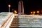 a group of steps leading up a stone building at night