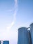 Group of storage fuel tanks inside of petroleum industrial area against blue sky in evening time