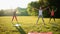 Group stretching workout, large group stretches outdoor on a green grass in park