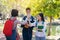 Group of student happy young people touch hands outdoors, Diverse Young Students Book Outdoors Concept