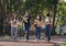 Group of student happy young people walking outdoors, Diverse Young Students Book Outdoors Concept