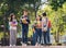 Group of student happy young people walking outdoors, Diverse Young Students Book Outdoors Concept