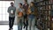 Group of students with books walking in library