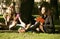 Group of students on grass, prepaing to exam