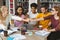 Group of students putting their fists together in library