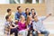 Group of students with smartphone and coffee cup