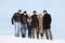 Group of students stand together on snow in winter