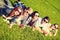 Group of students or teenagers lying in park