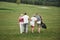 Group of stylish friends on the golf course learn to play a new game. The team is going to rest after the match