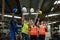 Group of Successful multiethnic engineer and technician worker throwing a hard hat in the Industry manufacturing factory