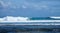 Group of surfers in the sea swell