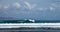 Group of surfers in the sea swell