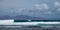 Group of surfers in the sea swell