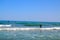 group of surfers surfing inTorremolinos, Costa del Sol, Spain