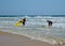 A group of surfers with their boards on the sunny beach of Fuerteventura.