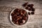 Group of tasty chestnuts next to a bowl