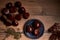 Group of tasty chestnuts next to a bowl