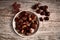 Group of tasty chestnuts next to a bowl