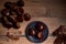 Group of tasty chestnuts next to a bowl