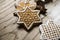 Group of tasty decorated Christmas star-shaped cookies on wooden background.