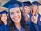 Group of Teen Girls Graduating In Cap and Gown on Campus