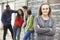 Group Of Teenage Friends Hanging Out In Urban Setting