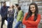 Group Of Teenage Friends Hanging Out In Urban Setting