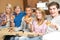 Group Of Teenage Friends Sitting On Sofa At Home